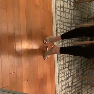 Nude wedges with clear heel.